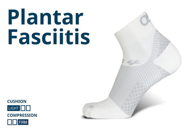 Low-cut black and gray athletic socks with ribbed and mesh zones, shown at an angle to highlight reinforced heel and toe area