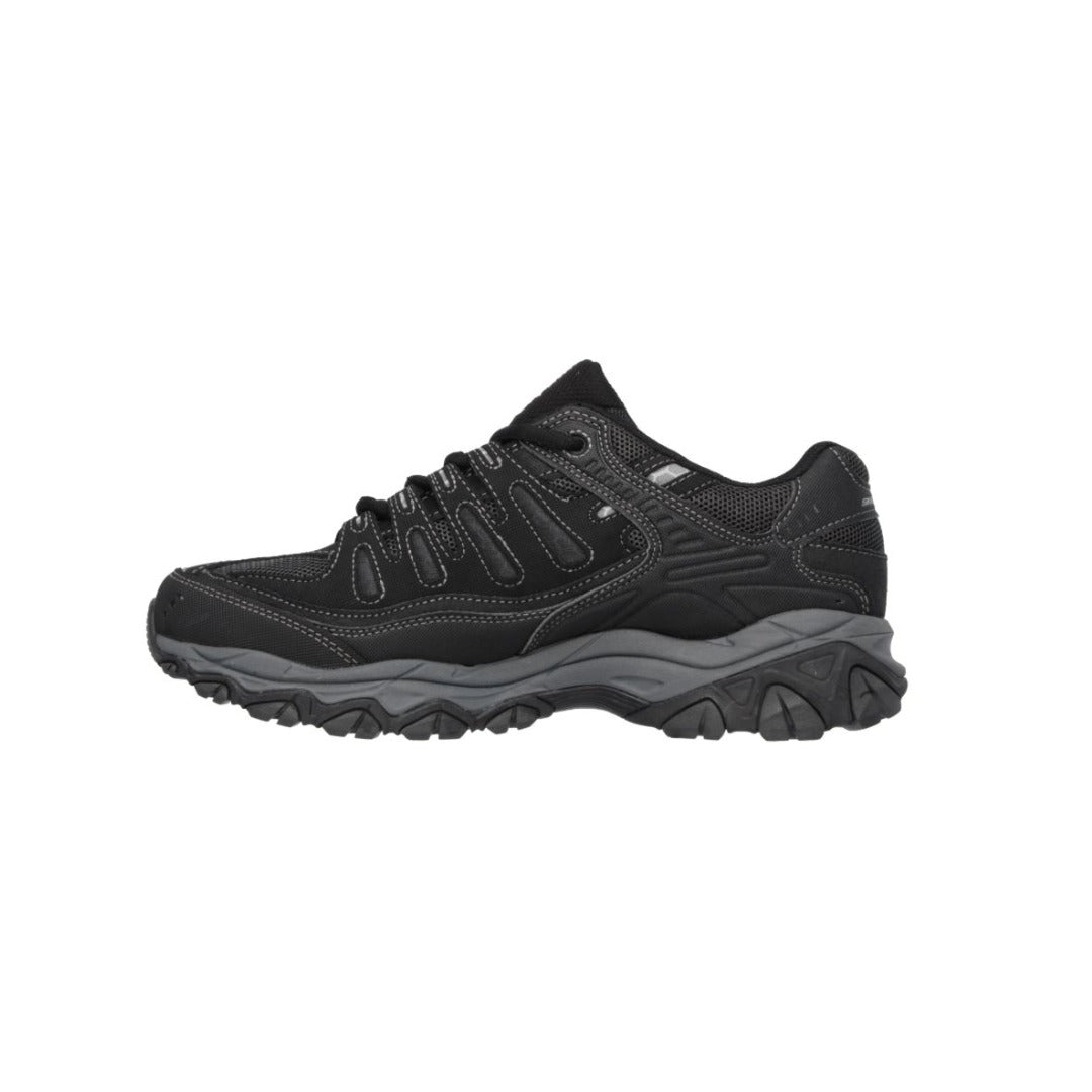 Black Skechers athletic sneaker with rugged sole, lace-up design, and visible Skechers logo on the side, designed for outdoor