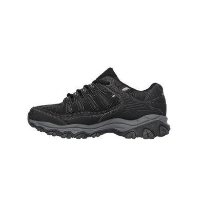 Black Skechers athletic sneaker with rugged sole, lace-up design, and visible Skechers logo on the side, designed for outdoor